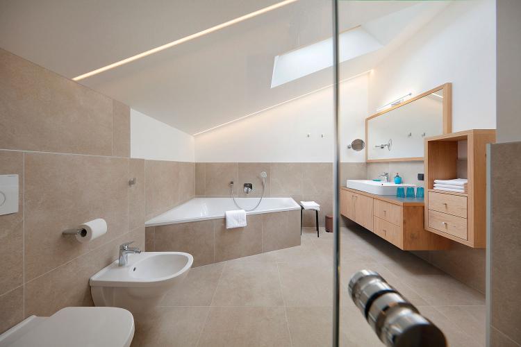 Large bathroom with bathtub & shower