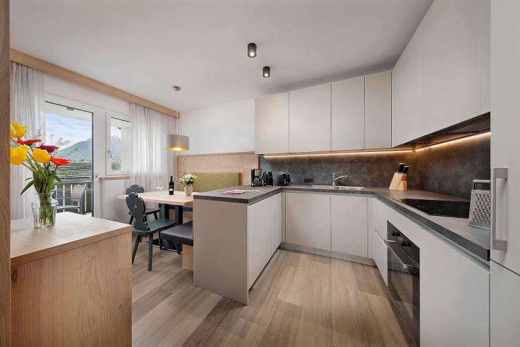 Kitchen with dining area and balcony access