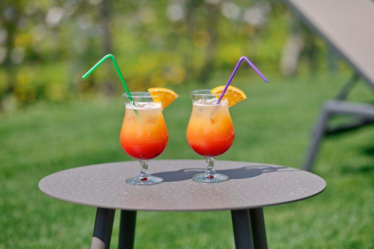 We'd be more than happy to bring you a cocktail to the garden